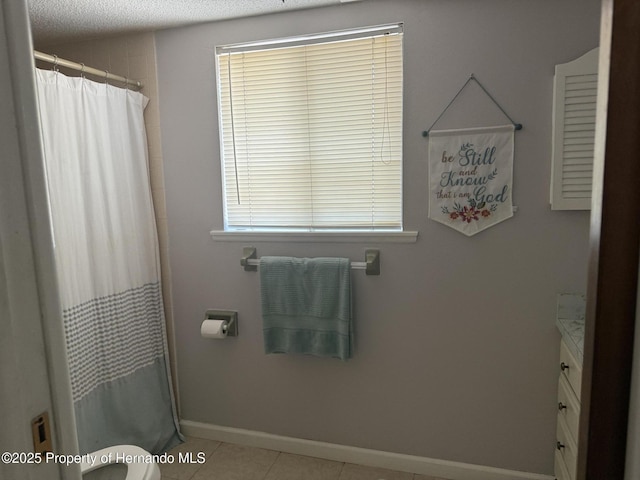 11087 Addison St, Spring Hill, FL 34609 - full bathroom featuring vanity, tile patterned floors, a textured ceiling, and a shower with curtain