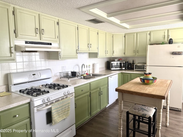 11087 Addison St, Spring Hill, FL 34609 - kitchen featuring white appliances, under cabinet range hood, green cabinetry, and dark wood-type flooring