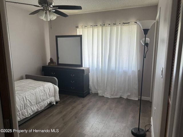 11087 Addison St, Spring Hill, FL 34609 - bedroom featuring wood finished floors and a textured ceiling