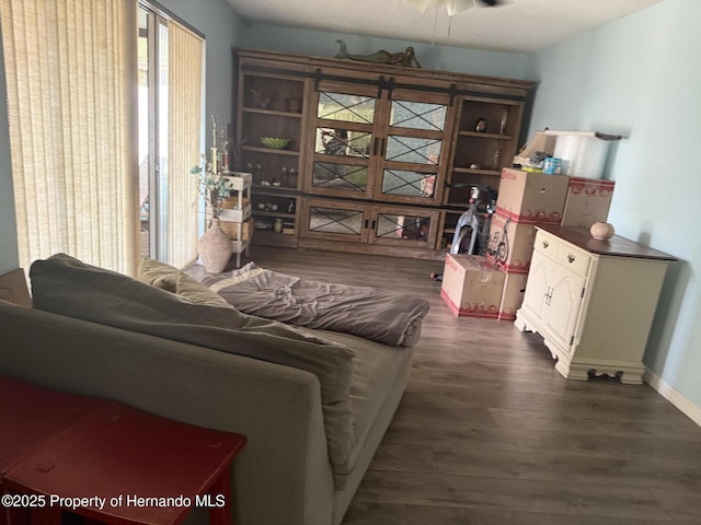 11087 Addison St, Spring Hill, FL 34609 - living room with dark wood-style floors and ceiling fan