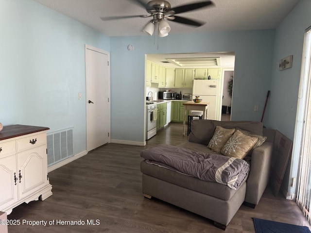 11087 Addison St, Spring Hill, FL 34609 - living room with ceiling fan and dark wood finished floors