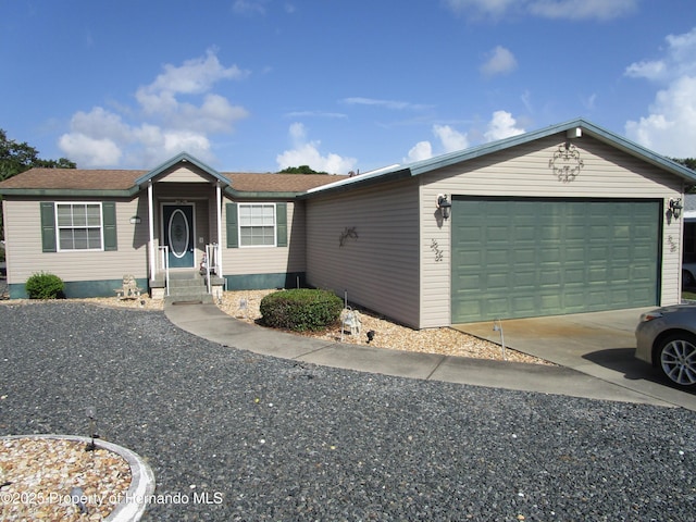 8423 Dickens Ave, Brooksville, FL 34613 - view of front facade featuring an attached garage, driveway, and entry steps