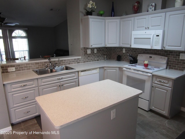 8423 Dickens Ave, Brooksville, FL 34613 - kitchen with white appliances, backsplash, a ceiling fan, and light countertops