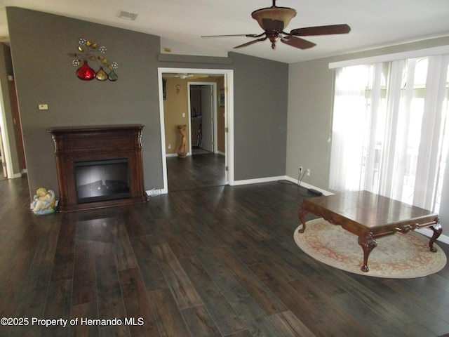 8423 Dickens Ave, Brooksville, FL 34613 - living area featuring ceiling fan, wood finished floors, and a glass covered fireplace