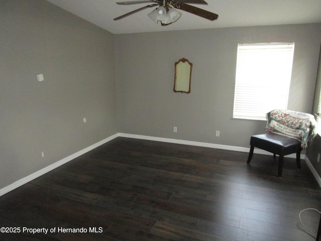 8423 Dickens Ave, Brooksville, FL 34613 - living area with a ceiling fan and dark wood finished floors