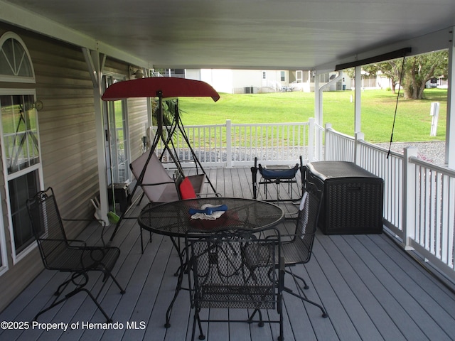 8423 Dickens Ave, Brooksville, FL 34613 - deck featuring a yard