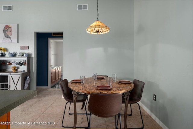 204 Oak Lake Dr, Spring Hill, FL 34608 - dining area featuring light tile patterned flooring and a towering ceiling