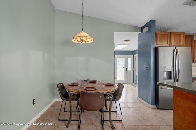 204 Oak Lake Dr, Spring Hill, FL 34608 - dining area featuring vaulted ceiling and light tile patterned flooring
