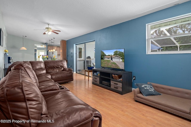 204 Oak Lake Dr, Spring Hill, FL 34608 - living room with plenty of natural light, ceiling fan, and wood finished floors