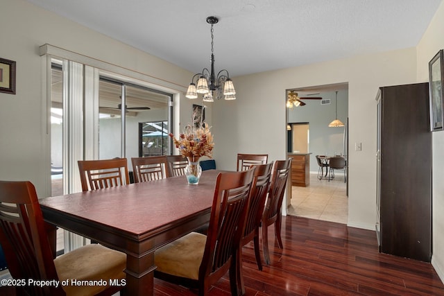 204 Oak Lake Dr, Spring Hill, FL 34608 - dining area with a chandelier and wood finished floors