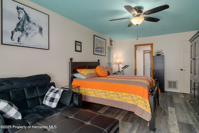 204 Oak Lake Dr, Spring Hill, FL 34608 - bedroom featuring dark wood finished floors and a ceiling fan