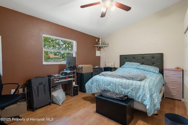 204 Oak Lake Dr, Spring Hill, FL 34608 - bedroom with wood finished floors, vaulted ceiling, ceiling fan, and a desk