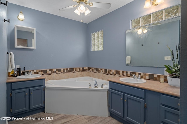 204 Oak Lake Dr, Spring Hill, FL 34608 - full bathroom featuring a ceiling fan, vanity, and a garden tub