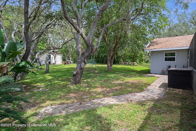 204 Oak Lake Dr, Spring Hill, FL 34608 - view of grassy yard featuring a shed