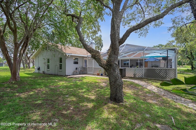 204 Oak Lake Dr, Spring Hill, FL 34608 - view of green lawn with glass enclosure
