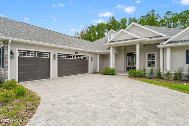 5018 Elm Leaf Dr, Brooksville, FL 34601 - view of front of property with an attached garage, decorative driveway, and roof with shingles