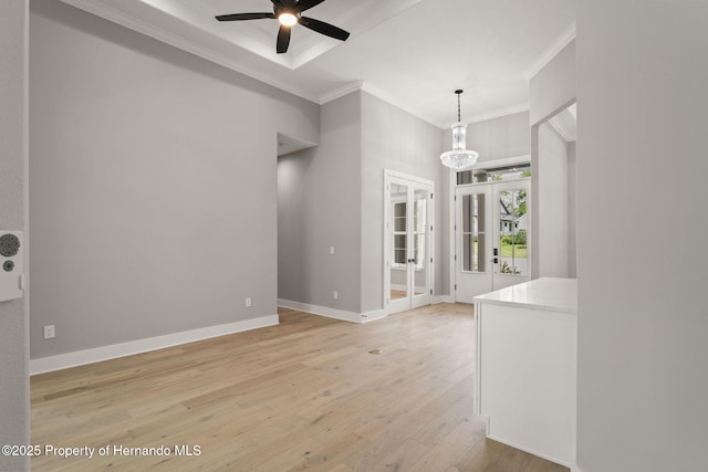 5018 Elm Leaf Dr, Brooksville, FL 34601 - unfurnished room with ceiling fan, crown molding, light wood-style floors, and french doors