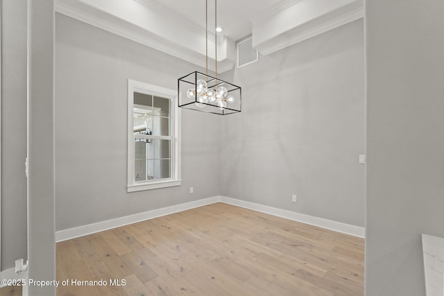 5018 Elm Leaf Dr, Brooksville, FL 34601 - unfurnished dining area featuring hardwood / wood-style flooring, ornamental molding, and a chandelier