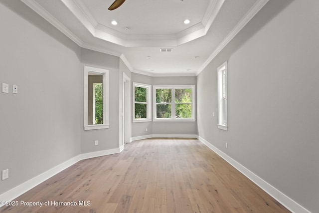 5018 Elm Leaf Dr, Brooksville, FL 34601 - unfurnished room with a raised ceiling, ceiling fan, light wood-type flooring, crown molding, and recessed lighting
