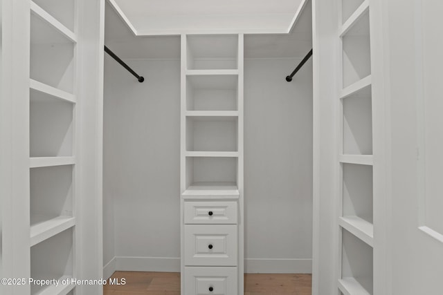 5018 Elm Leaf Dr, Brooksville, FL 34601 - walk in closet with wood finished floors