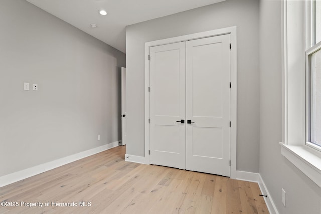 5018 Elm Leaf Dr, Brooksville, FL 34601 - unfurnished bedroom featuring light wood-style floors, a closet, and recessed lighting