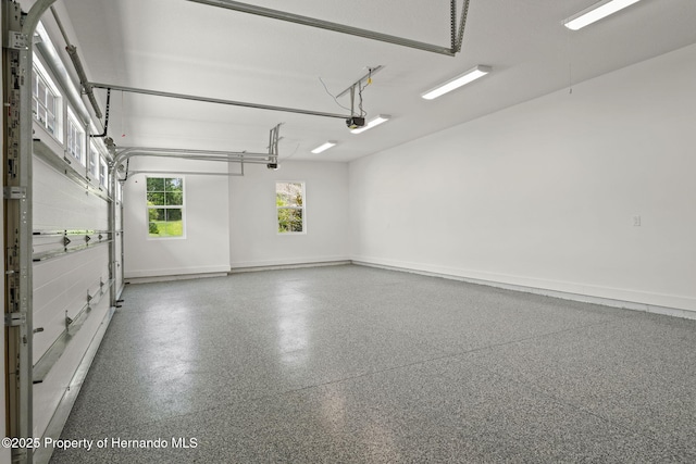 5018 Elm Leaf Dr, Brooksville, FL 34601 - garage featuring baseboards