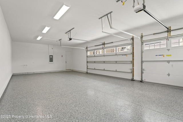5018 Elm Leaf Dr, Brooksville, FL 34601 - garage featuring a garage door opener and electric panel