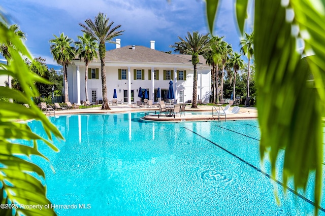 5018 Elm Leaf Dr, Brooksville, FL 34601 - community pool featuring a patio