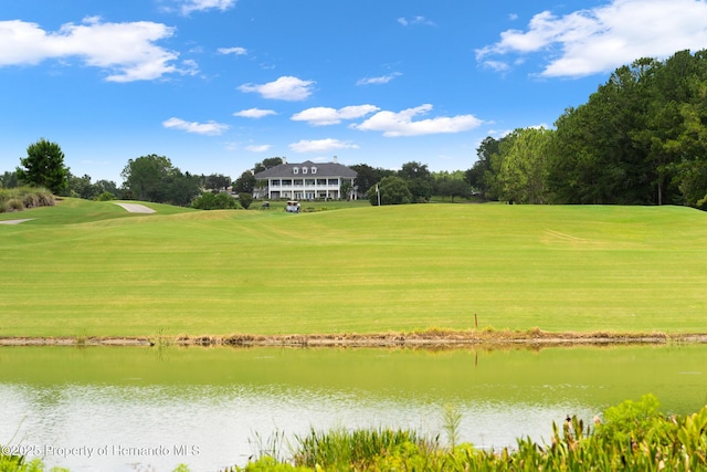 5018 Elm Leaf Dr, Brooksville, FL 34601 - view of property's community featuring a water view, a yard, and view of golf course