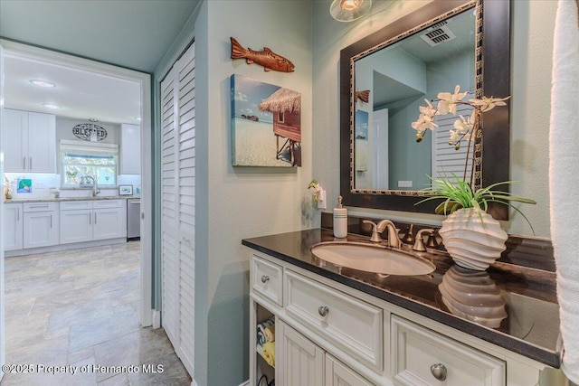 5233 Tuscawilla Dr, Weeki Wachee, FL 34607 - bathroom with vanity and stone finish flooring