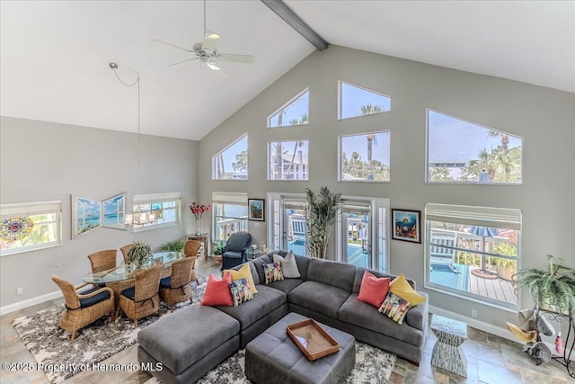 5233 Tuscawilla Dr, Weeki Wachee, FL 34607 - living room with high vaulted ceiling, healthy amount of natural light, a ceiling fan, beamed ceiling, and stone finish flooring