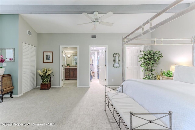 5233 Tuscawilla Dr, Weeki Wachee, FL 34607 - bedroom featuring light colored carpet, a closet, ensuite bath, and a ceiling fan
