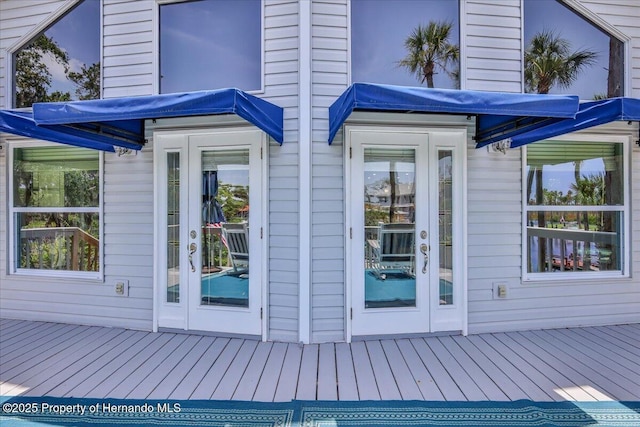 5233 Tuscawilla Dr, Weeki Wachee, FL 34607 - entrance to property with a wooden deck