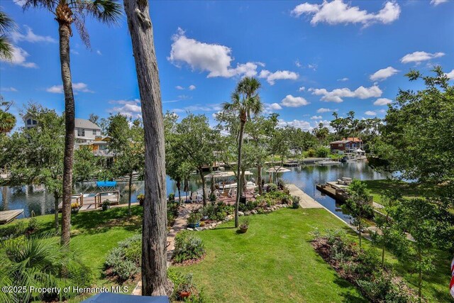 5233 Tuscawilla Dr, Weeki Wachee, FL 34607 - dock with a water view and a lawn