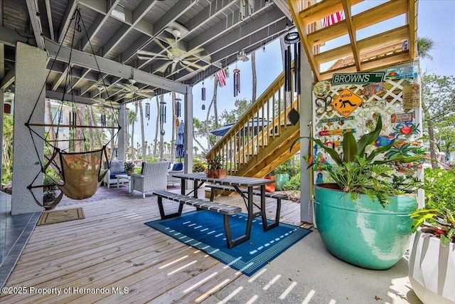 5233 Tuscawilla Dr, Weeki Wachee, FL 34607 - wooden terrace with stairway and a ceiling fan
