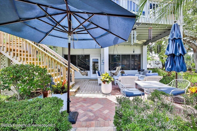 5233 Tuscawilla Dr, Weeki Wachee, FL 34607 - view of patio with stairs, a wooden deck, and outdoor lounge area