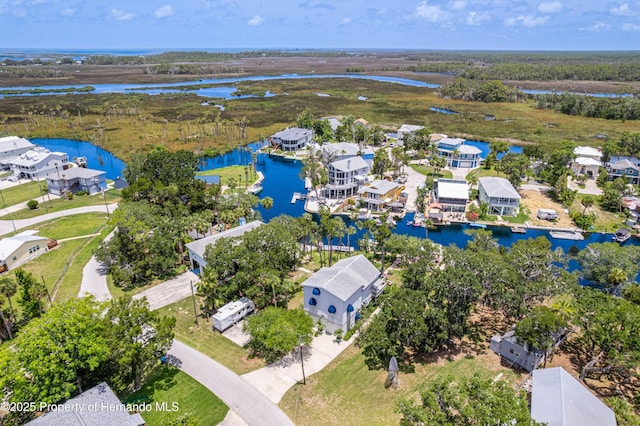 5233 Tuscawilla Dr, Weeki Wachee, FL 34607 - aerial perspective of suburban area featuring a nearby body of water
