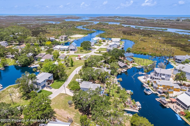 5233 Tuscawilla Dr, Weeki Wachee, FL 34607 - aerial perspective of suburban area featuring a large body of water