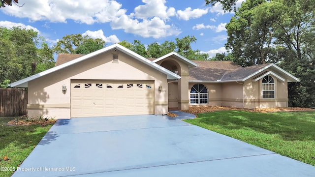 13094 Huntington Woods Ave, Spring Hill, FL 34609 - ranch-style house with stucco siding, concrete driveway, and a garage
