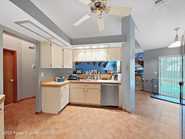 13094 Huntington Woods Ave, Spring Hill, FL 34609 - kitchen with dishwasher, light countertops, ceiling fan, light tile patterned floors, and a textured ceiling