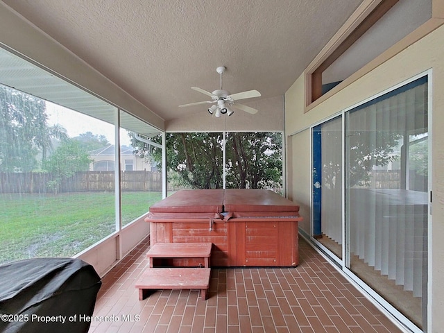 13094 Huntington Woods Ave, Spring Hill, FL 34609 - sunroom / solarium featuring a hot tub, ceiling fan, and vaulted ceiling