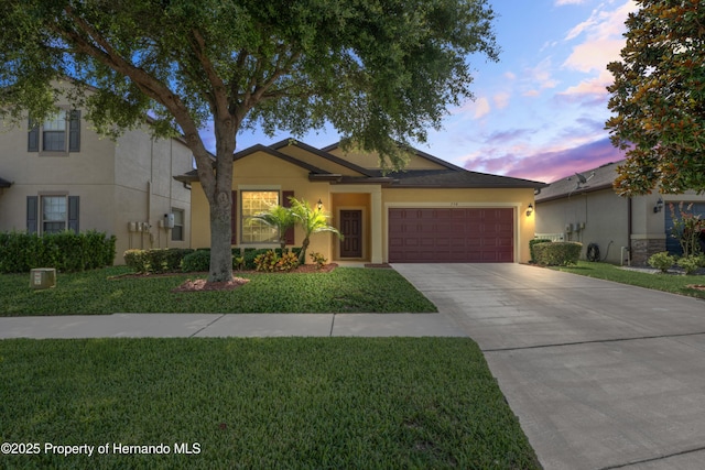 758 Alpine Thistle Dr, Brooksville, FL 34604 - ranch-style house with a garage, stucco siding, driveway, and a front yard