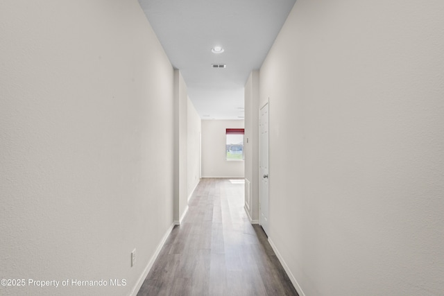 758 Alpine Thistle Dr, Brooksville, FL 34604 - hallway with dark wood-style flooring and baseboards