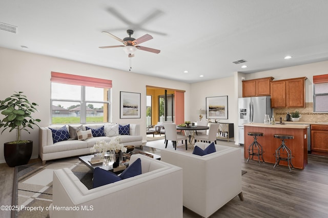 758 Alpine Thistle Dr, Brooksville, FL 34604 - living room featuring dark wood-style flooring, a ceiling fan, and recessed lighting