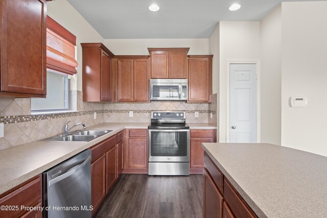 758 Alpine Thistle Dr, Brooksville, FL 34604 - kitchen with appliances with stainless steel finishes, dark wood-style flooring, decorative backsplash, light countertops, and recessed lighting