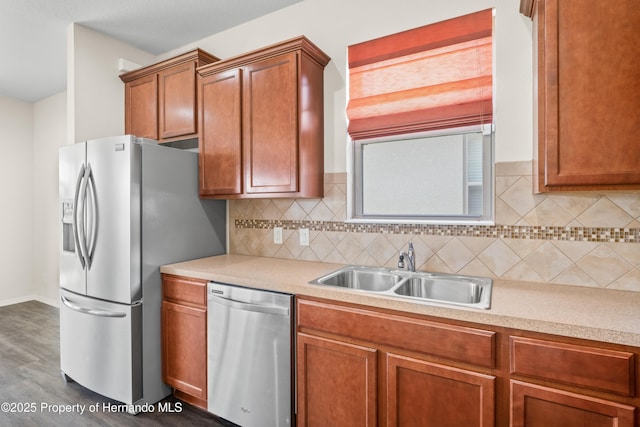 758 Alpine Thistle Dr, Brooksville, FL 34604 - kitchen featuring appliances with stainless steel finishes, light countertops, decorative backsplash, and brown cabinetry