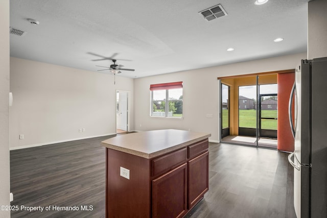 758 Alpine Thistle Dr, Brooksville, FL 34604 - kitchen with freestanding refrigerator, ceiling fan, dark wood-style floors, open floor plan, and recessed lighting