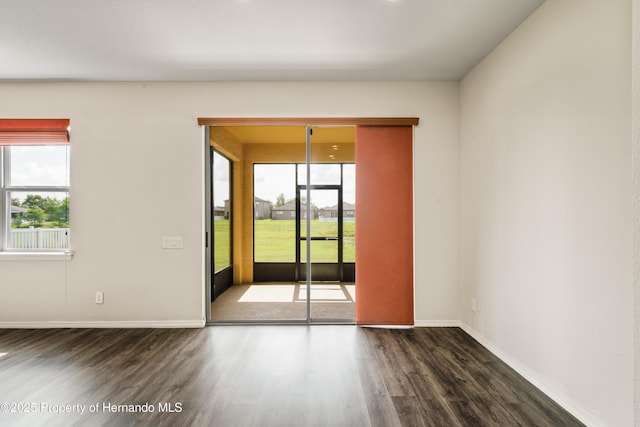 758 Alpine Thistle Dr, Brooksville, FL 34604 - empty room with wood finished floors and plenty of natural light