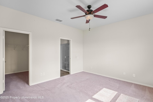 758 Alpine Thistle Dr, Brooksville, FL 34604 - unfurnished bedroom featuring carpet flooring, a spacious closet, a closet, and ensuite bath