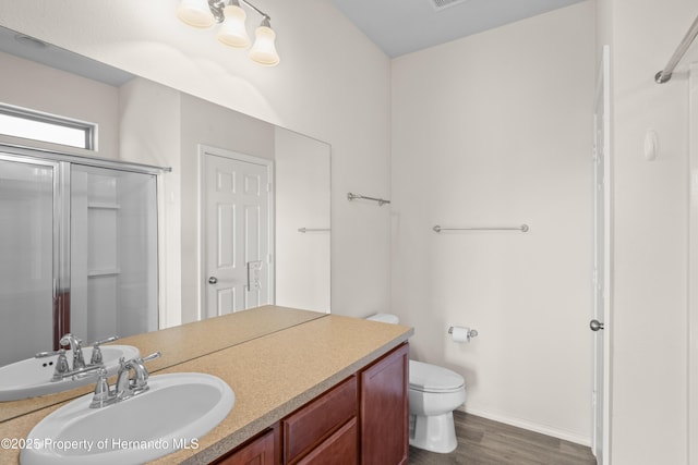758 Alpine Thistle Dr, Brooksville, FL 34604 - bathroom with a shower stall, wood finished floors, and vanity